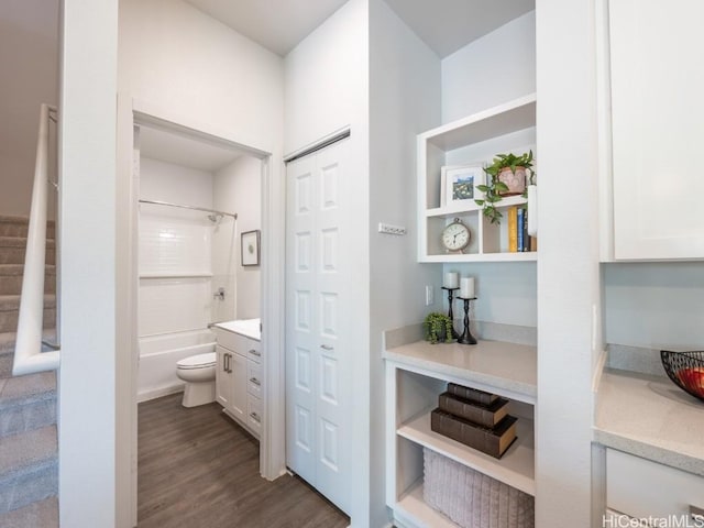 full bathroom featuring shower / bathtub combination, wood-type flooring, toilet, and vanity