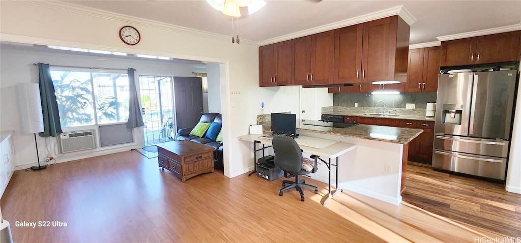 98-921 Noelani St Unit B, Pearl City, HI 96782 - kitchen featuring a breakfast bar, a peninsula, ornamental molding, stainless steel refrigerator with ice dispenser, and light wood-type flooring