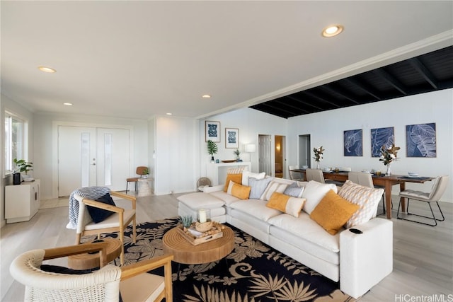 living room featuring light hardwood / wood-style flooring and french doors