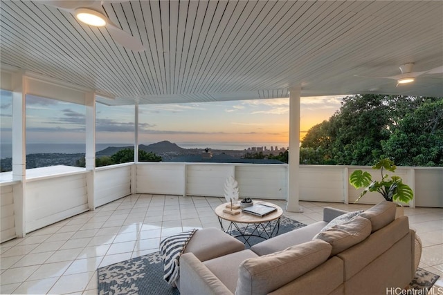 interior space featuring an outdoor hangout area and ceiling fan