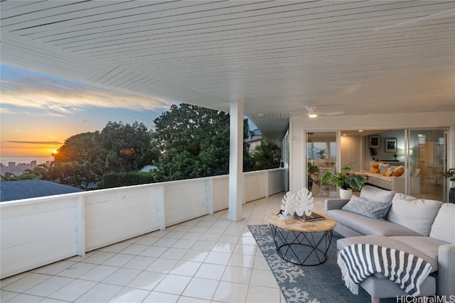 patio terrace at dusk featuring an outdoor living space