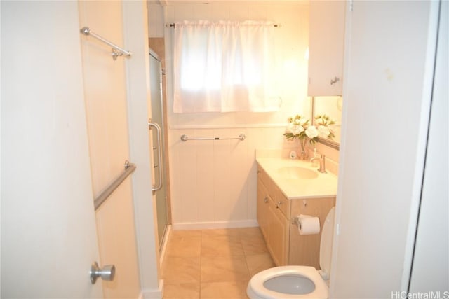 bathroom with vanity, toilet, an enclosed shower, and tile patterned flooring