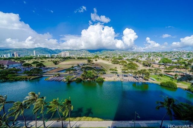 birds eye view of property with a water and mountain view