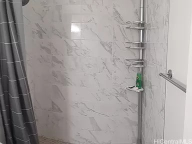 bathroom featuring a shower with curtain