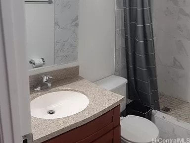 bathroom with vanity, toilet, and a shower with shower curtain