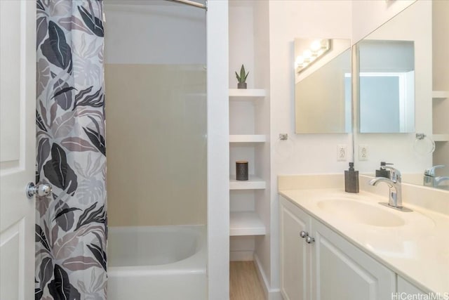 bathroom with vanity, shower / bathtub combination with curtain, and wood-type flooring