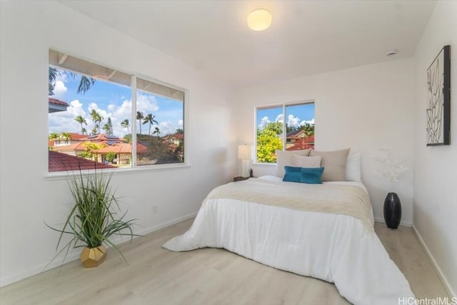 bedroom with hardwood / wood-style flooring