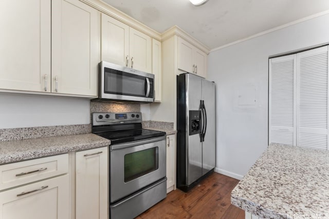 kitchen with light stone countertops, dark wood-type flooring, stainless steel appliances, and ornamental molding