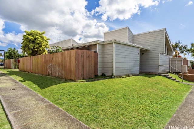 view of home's exterior featuring a lawn