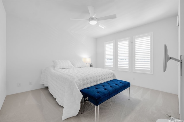 carpeted bedroom featuring a ceiling fan