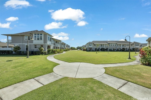 view of home's community featuring a lawn