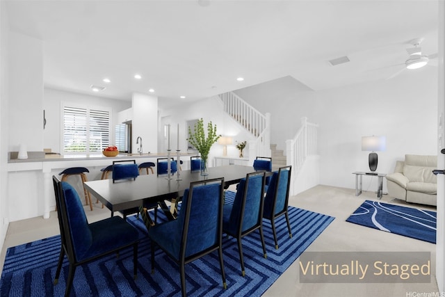 dining area with stairway, a ceiling fan, visible vents, and recessed lighting