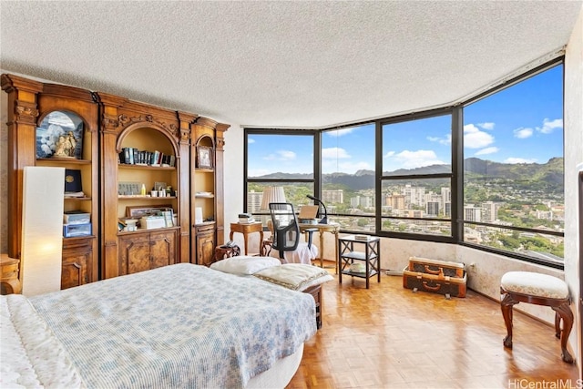 1221 Victoria St Unit 3201, Honolulu, HI 96814 - bedroom with a textured ceiling and a mountain view