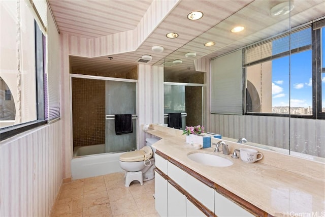 1221 Victoria St Unit 3201, Honolulu, HI 96814 - bathroom with visible vents, bath / shower combo with glass door, vanity, and toilet