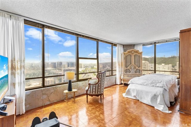 1221 Victoria St Unit 3201, Honolulu, HI 96814 - bedroom featuring a textured ceiling and a city view