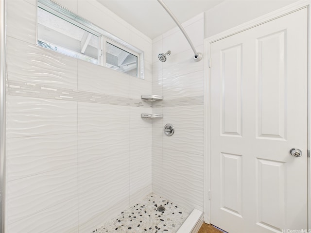 full bathroom with a tile shower