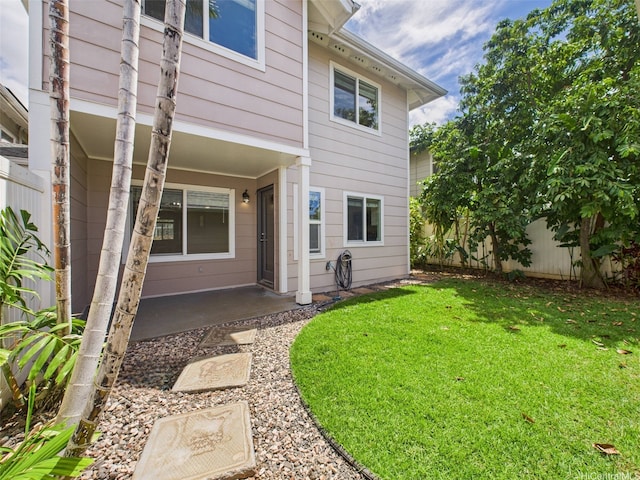 back of property with a yard