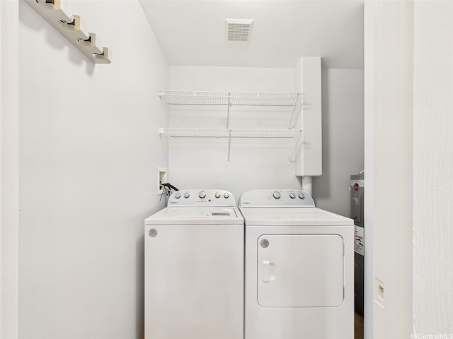 laundry area featuring laundry area, visible vents, and washing machine and dryer