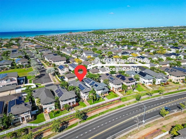 birds eye view of property with a water view and a residential view