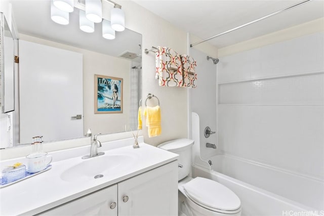 bathroom featuring shower / bath combination, vanity, and toilet