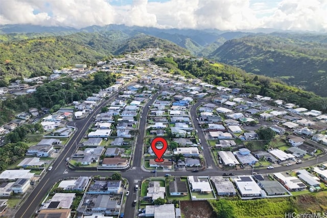 birds eye view of property with a mountain view