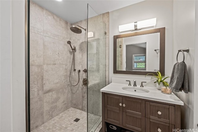 bathroom featuring vanity and a tile shower