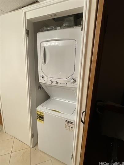 1600 Ala Moana Blvd Unit 3202, Honolulu, HI 96814 - washroom with stacked washer / drying machine, light tile patterned floors, and laundry area
