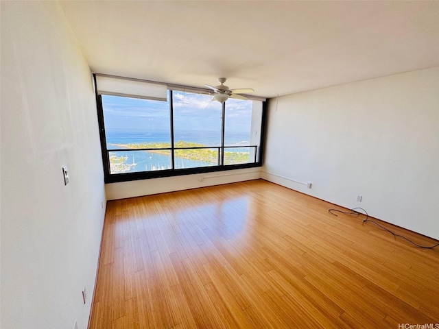 1600 Ala Moana Blvd Unit 3202, Honolulu, HI 96814 - unfurnished room with light wood-style floors and a ceiling fan