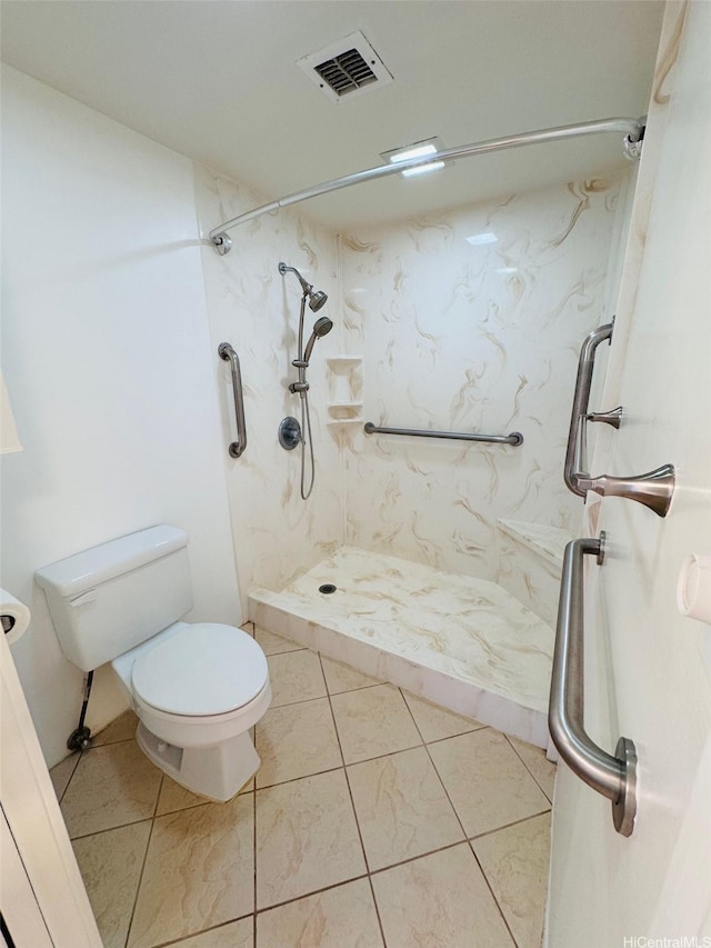 1600 Ala Moana Blvd Unit 3202, Honolulu, HI 96814 - bathroom featuring visible vents, tile patterned flooring, toilet, and a shower stall