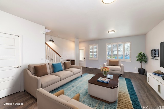 living room with dark hardwood / wood-style flooring