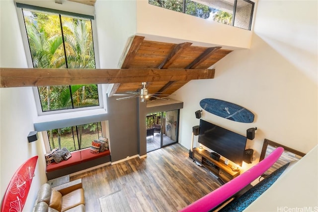 living room with wood ceiling, wood-type flooring, a wealth of natural light, and beam ceiling