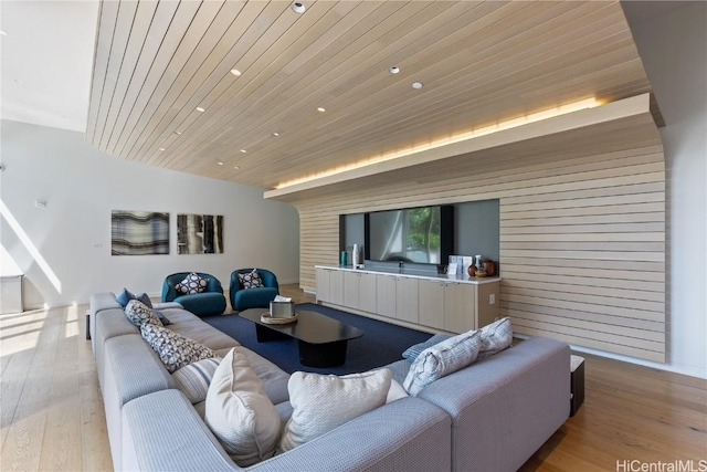 living room featuring recessed lighting, wood ceiling, and light wood-style floors