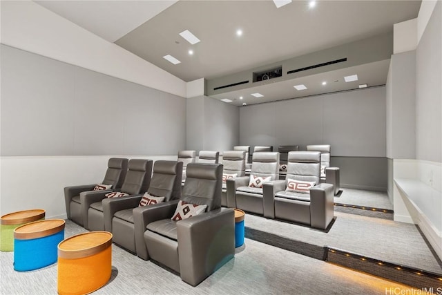 cinema room featuring lofted ceiling, light colored carpet, baseboards, and recessed lighting