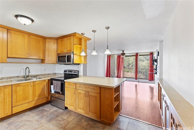 kitchen featuring stainless steel appliances, a peninsula, a sink, light countertops, and open shelves