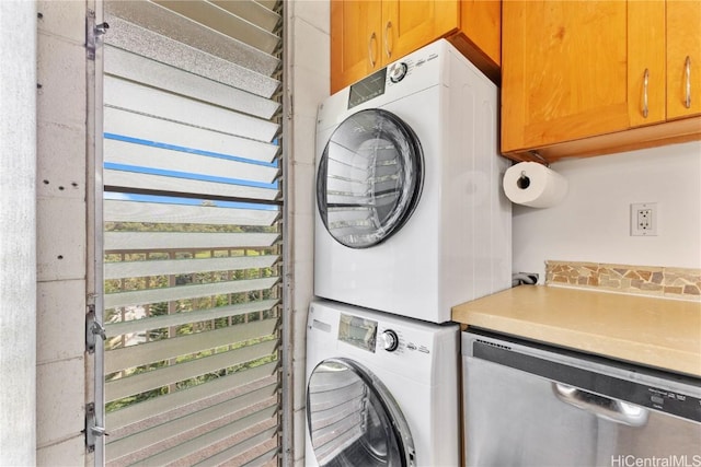 washroom with laundry area and stacked washer and clothes dryer