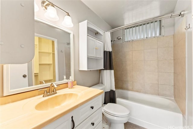 full bath with vanity, shower / bath combo with shower curtain, and toilet