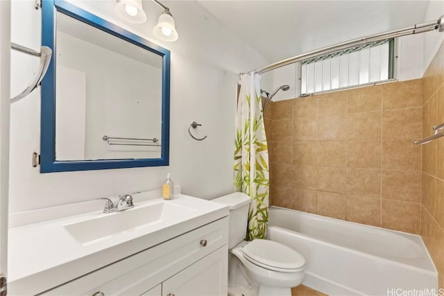 full bathroom with shower / tub combo, vanity, and toilet