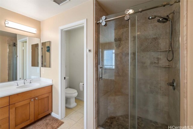 full bath featuring visible vents, toilet, a shower stall, vanity, and tile patterned flooring