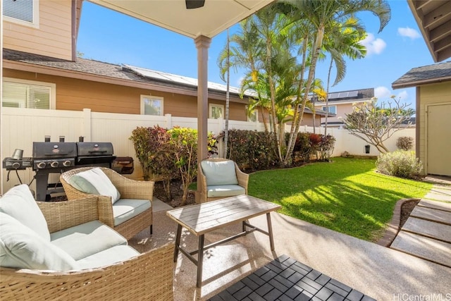 view of patio / terrace with fence, an outdoor living space, and area for grilling