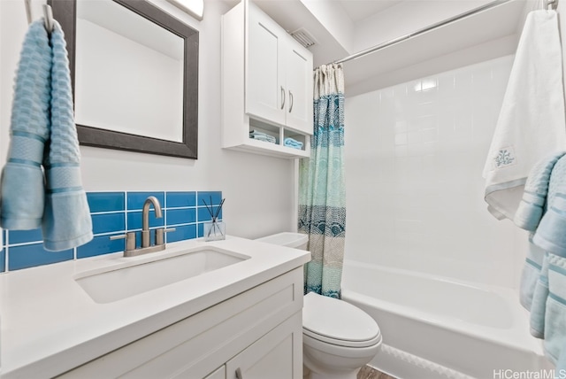 full bathroom with shower / bath combo, visible vents, toilet, vanity, and backsplash