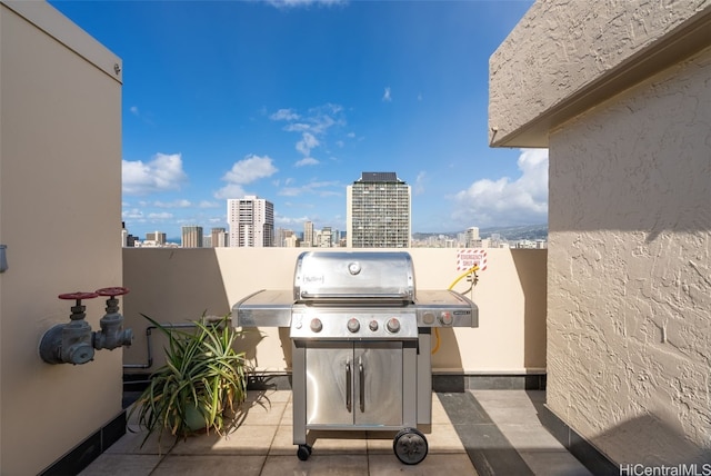 view of patio / terrace with a view of city and area for grilling