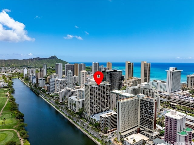 birds eye view of property with a view of city and a water view