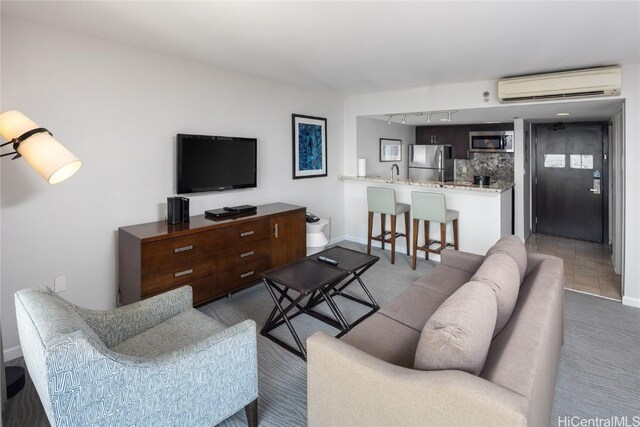1777 Ala Moana Blvd Unit 2206, Honolulu, HI 96815 - living room with rail lighting, a wall mounted AC, and sink