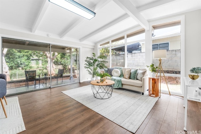 sunroom with vaulted ceiling with beams