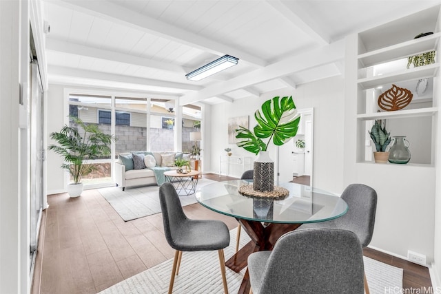 sunroom / solarium with lofted ceiling with beams