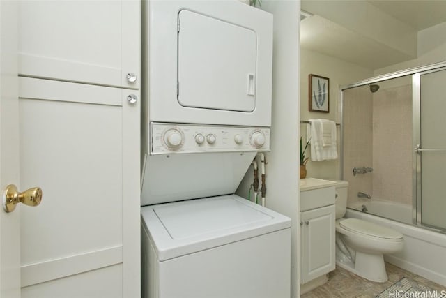 interior space featuring stacked washer / drying machine