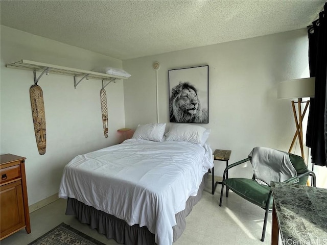 bedroom featuring a textured ceiling