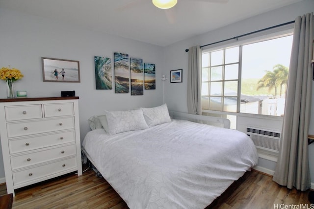 bedroom with dark wood-type flooring and ceiling fan