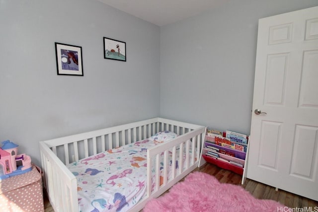 bedroom featuring hardwood / wood-style flooring