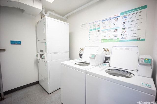 laundry area with washing machine and clothes dryer and stacked washer / dryer